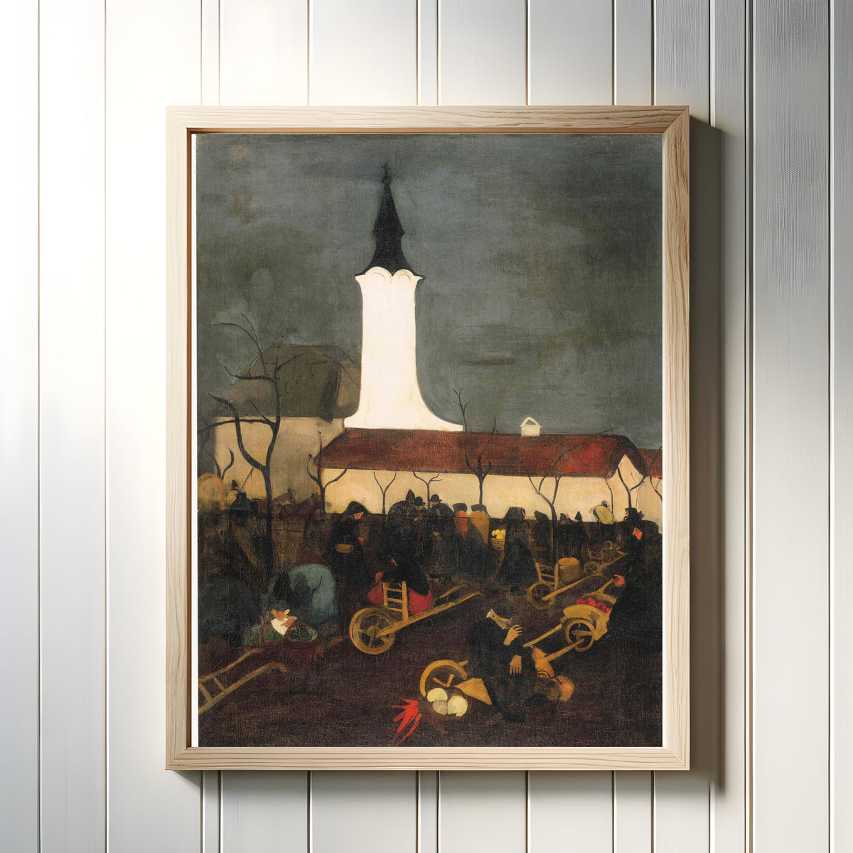 Framed art print of Hungarian Village Market (1938) by Amrita Sher-Gil, in a light wood frame on a white panelled wall