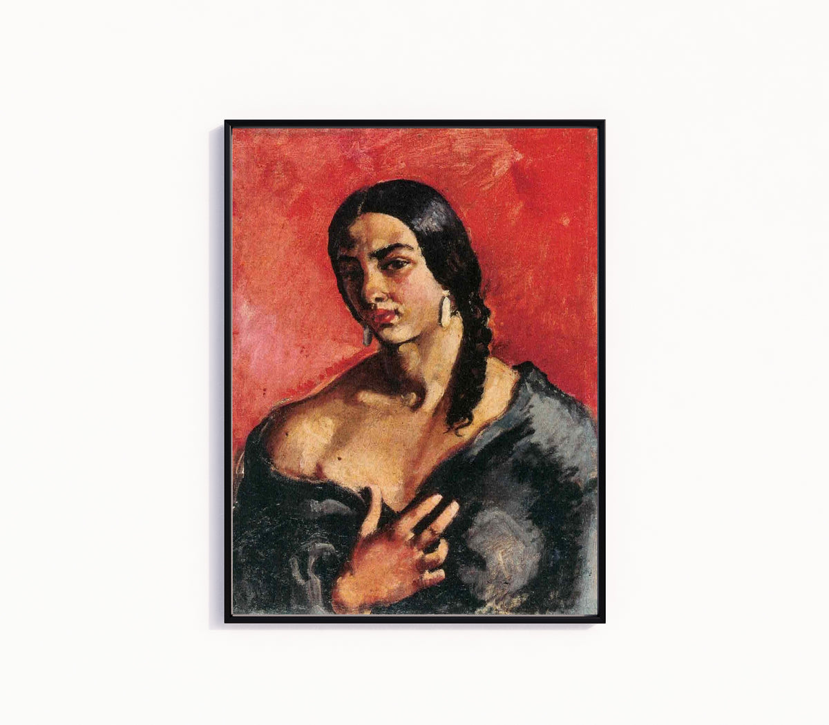Framed art print of Self-Portrait with Red Background (c. 1930) by Amrita Sher-Gil, in a slim black frame on a plain white wall