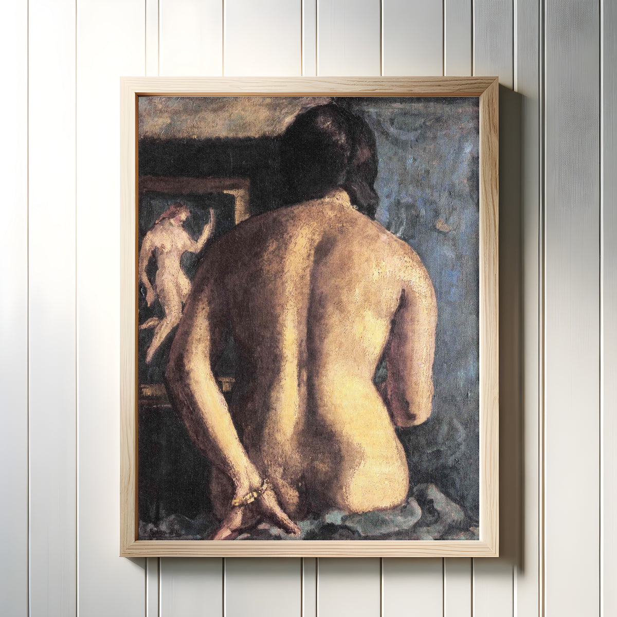 Framed art print of Torso (1932) by Amrita Sher-Gil, in a light wood frame on a white panelled wall