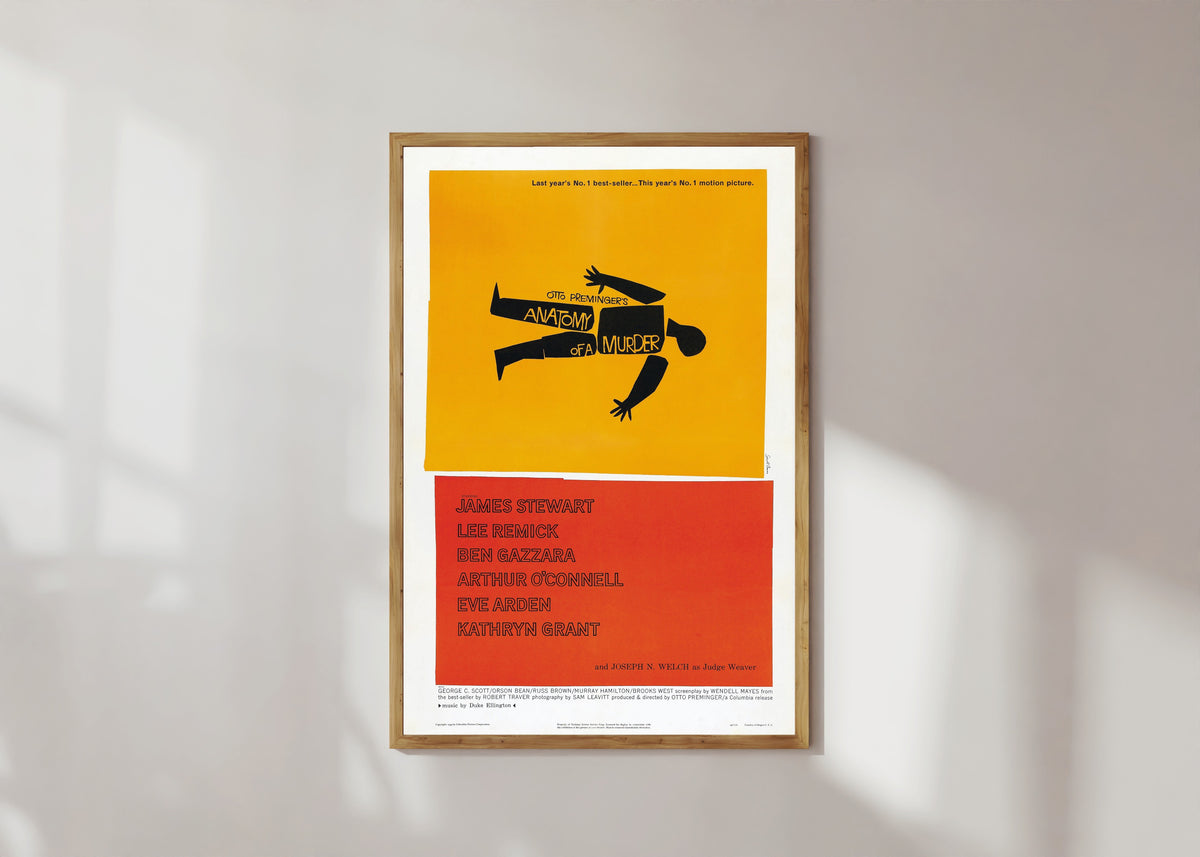 Framed art print of Anatomy of a Murder by Saul Bass, in a light wood frame on a sunlit white wall