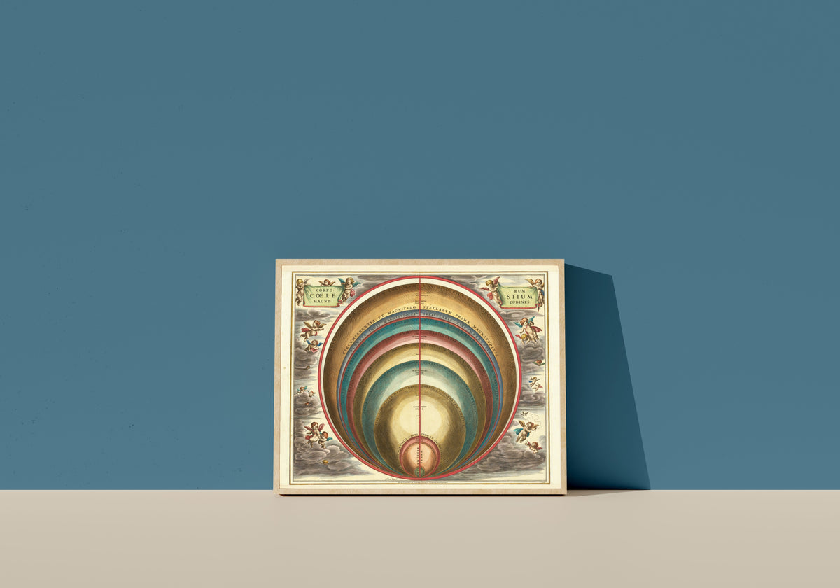 Framed art print of The Magnitudes of the Celestial Bodies (Plate 10, Gold Colouring) by Andreas Cellarius, in a light wood frame leaning on a blue wall