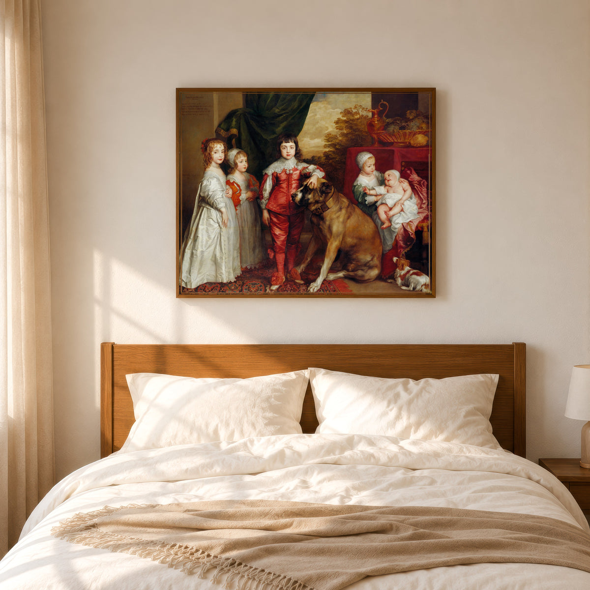 Framed art print of The Five Eldest Children of Charles I by Anthony van Dyck, in a slim wood frame above a bed in a sunlit bedroom