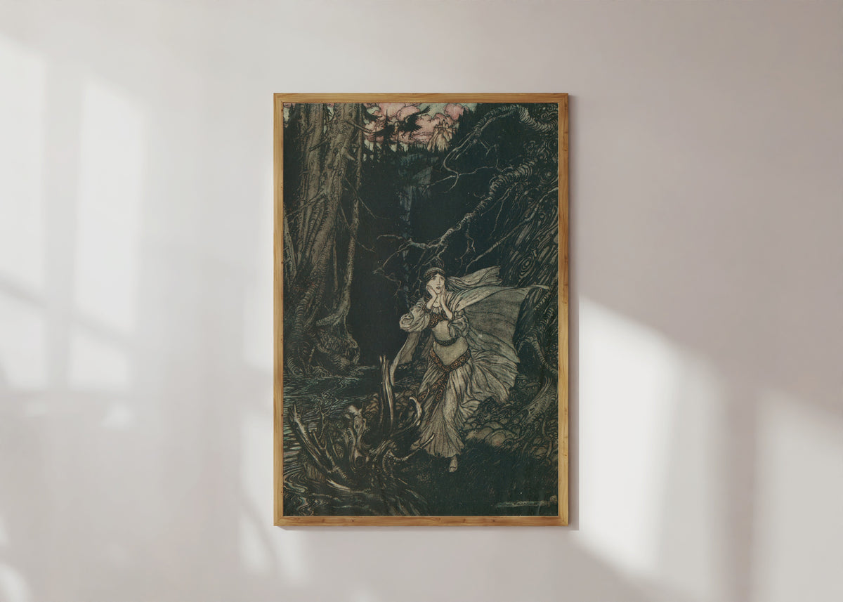 Framed art print of Bertalda in the Black Valley by Arthur Rackham, in a light wood frame on a sunlit white wall