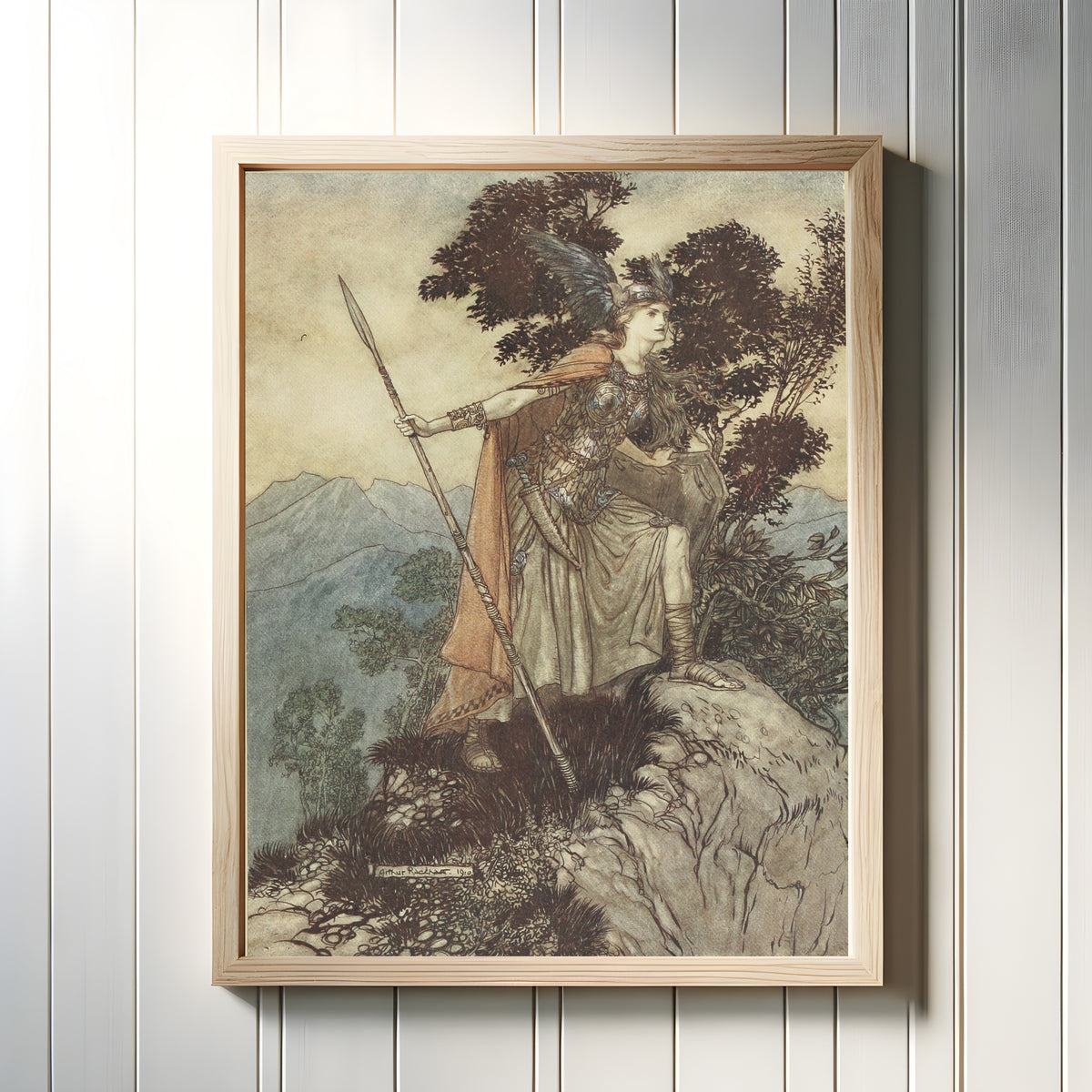 Framed art print of Brünnhilde by Arthur Rackham, in a light wood frame on a white panelled wall