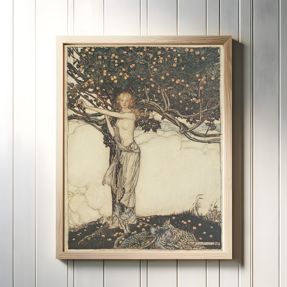Framed art print of Freia, the Fair One by Arthur Rackham, in a light wood frame on a white panelled wall
