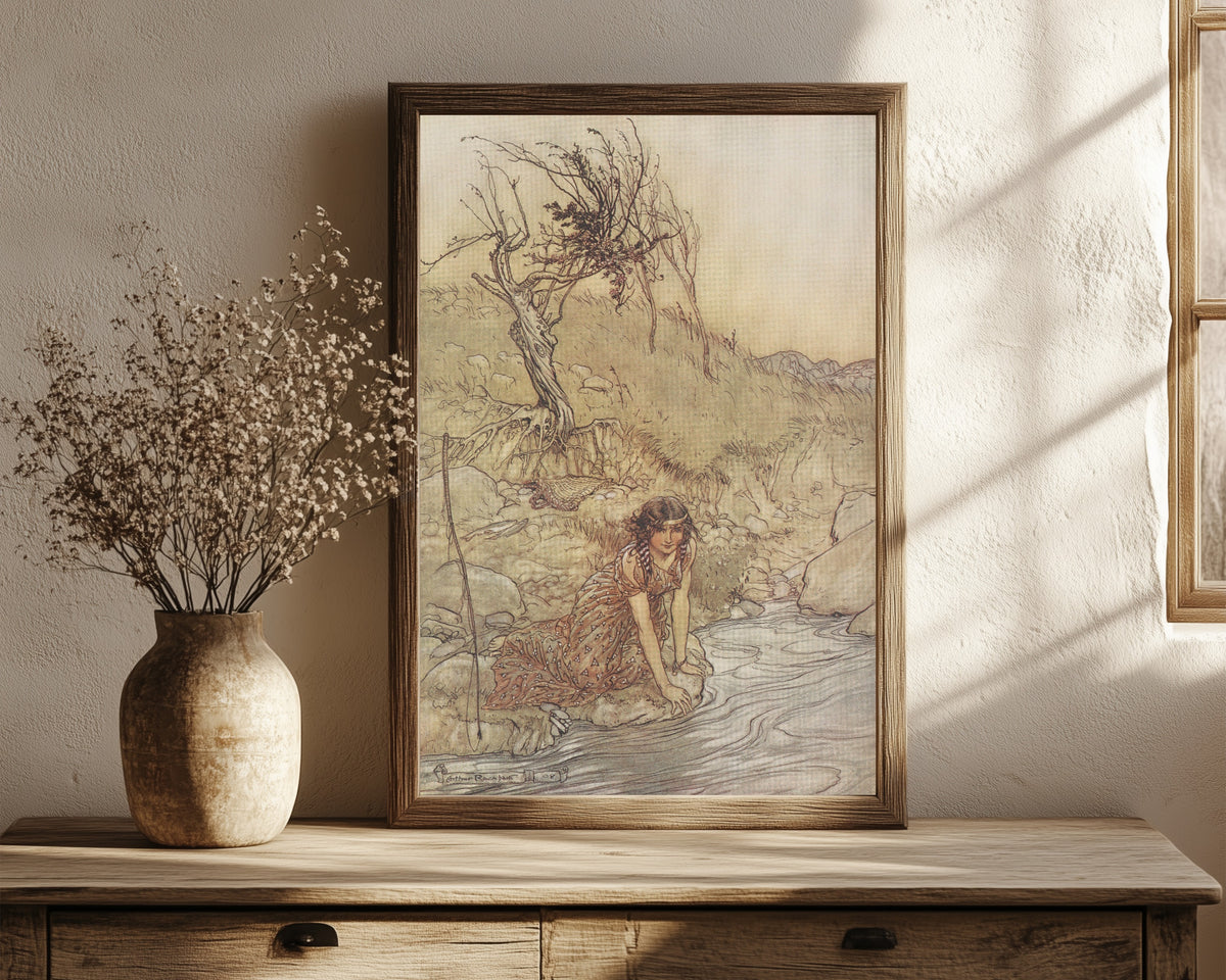 Framed art print of Hermia by Arthur Rackham, in a dark wood frame leaning on a rustic console beside dried flowers