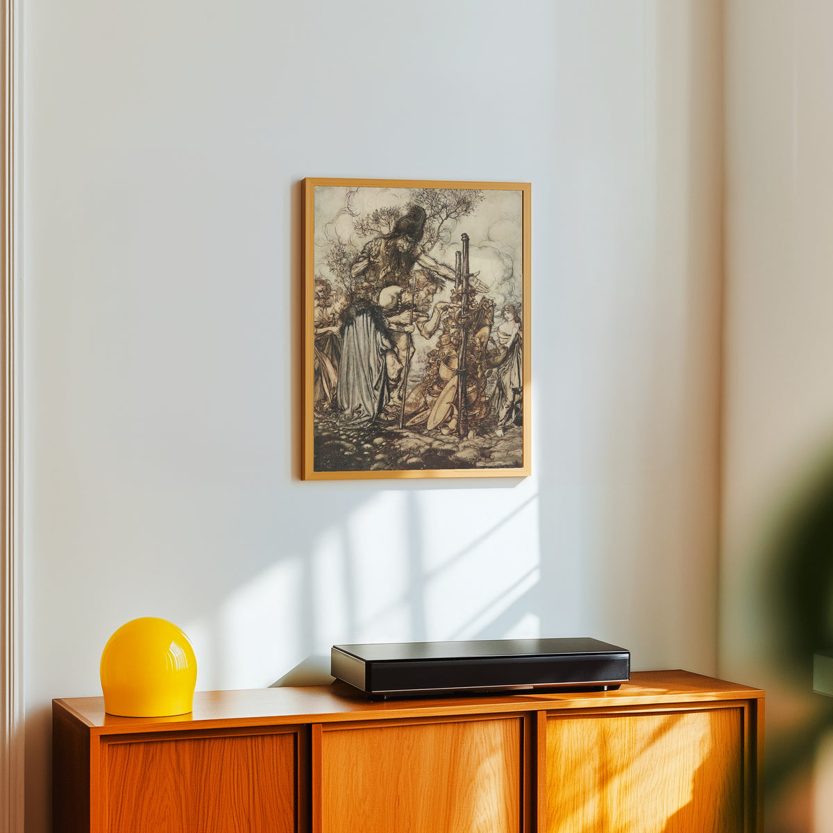 Framed art print of Hey! Come Hither, and Stop Me This Cranny! by Arthur Rackham, in a light wood frame on a white wall above an orange sideboard