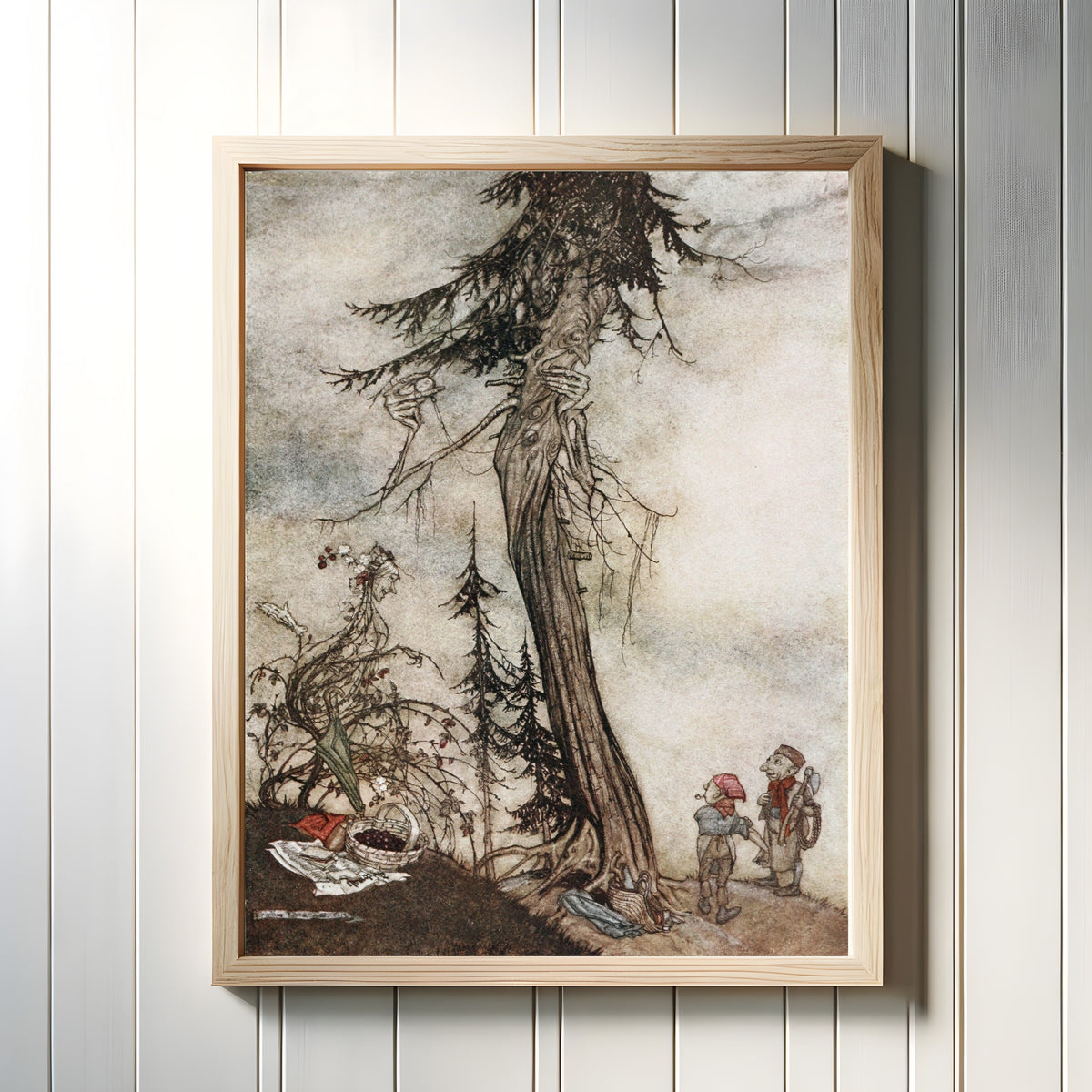 Framed art print of The Fir-Tree and the Bramble by Arthur Rackham, in a light wood frame on a white panelled wall