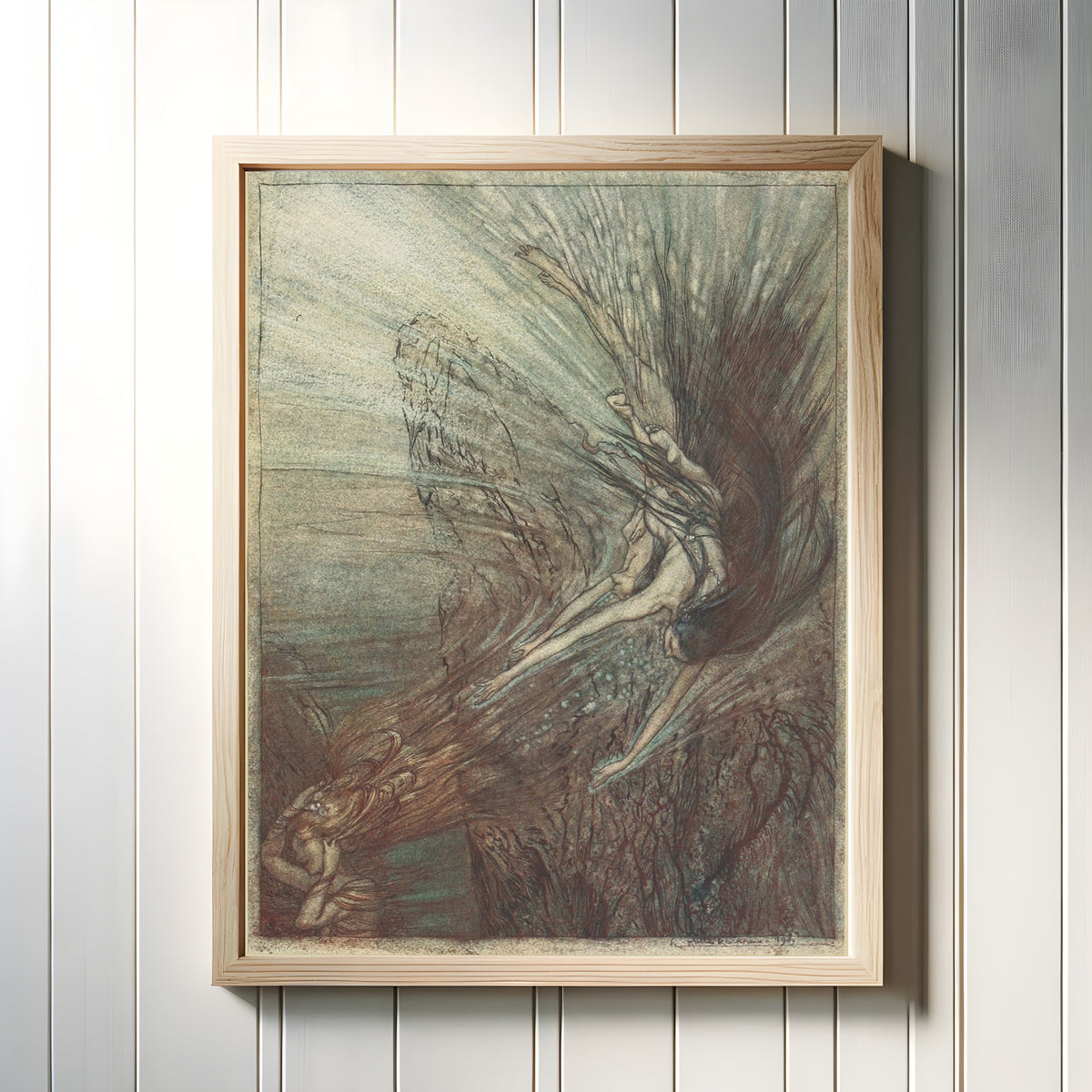 Framed art print of The Frolic of the Rhine-Maidens by Arthur Rackham, in a light wood frame on a white panelled wall