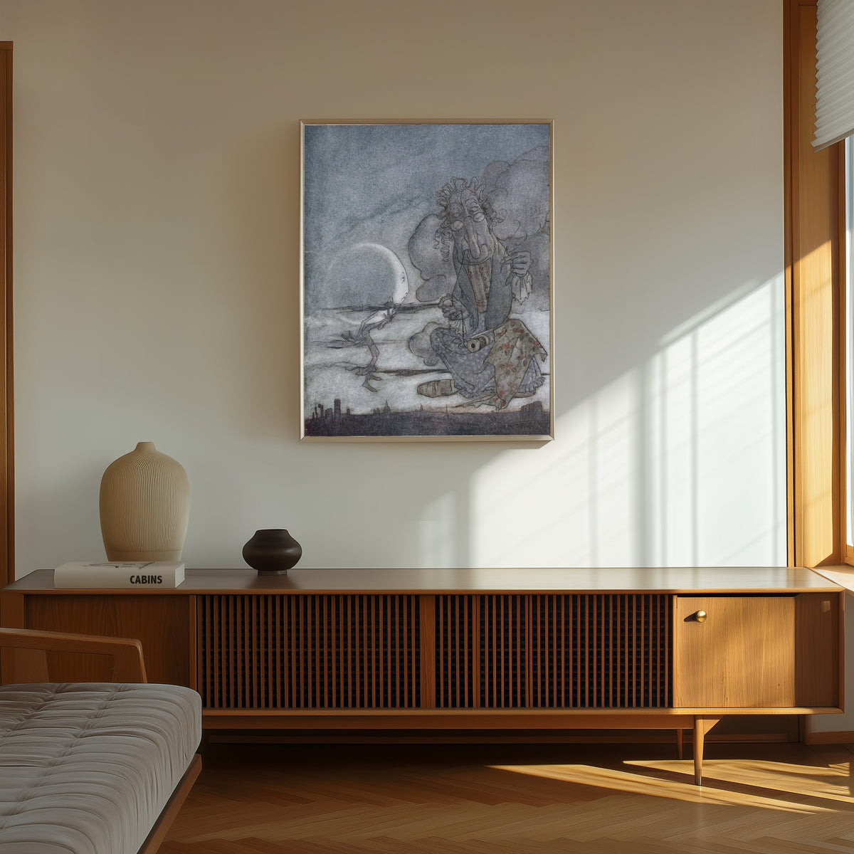 Framed art print of The Moon and Her Mother by Arthur Rackham, in a thin light frame on a sunlit wall above a wooden sideboard