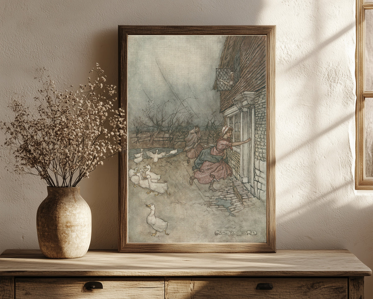 Framed art print of The Rain Always Made a Point of Setting In by Arthur Rackham, in a dark wood frame leaning on a rustic console beside dried flowers