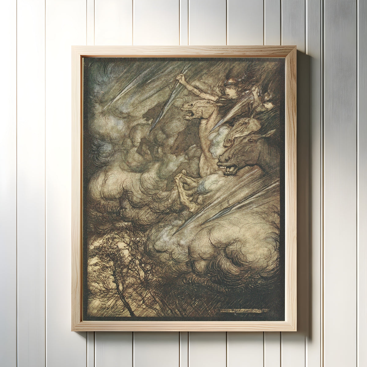 Framed art print of The Ride of the Valkyries by Arthur Rackham, in a light wood frame on a white panelled wall