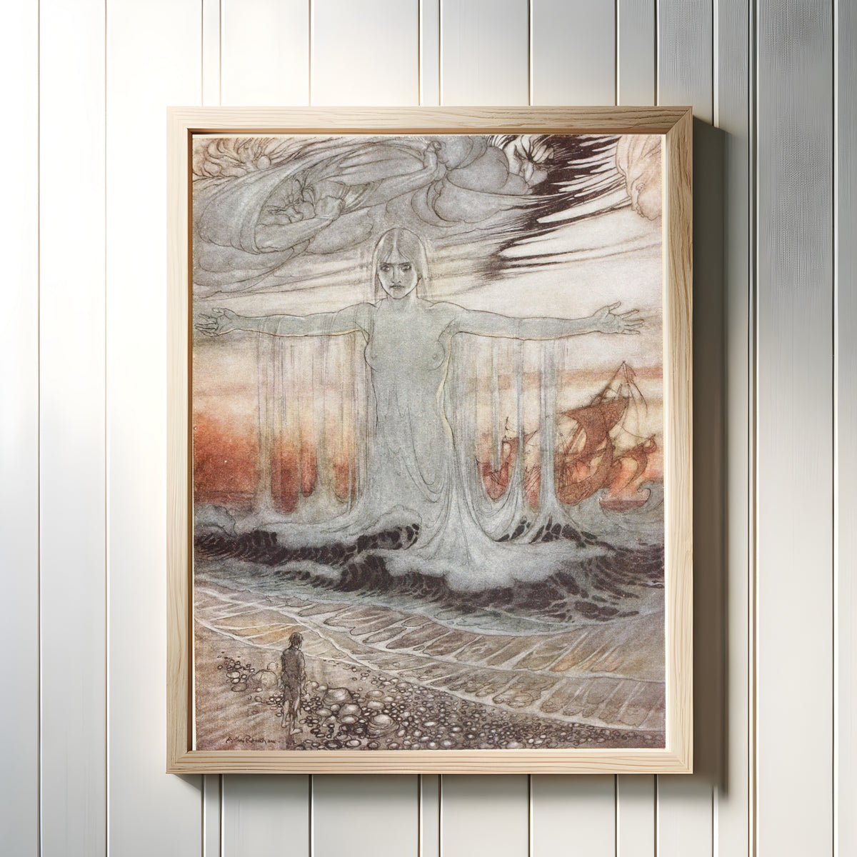 Framed art print of The Shipwrecked Man and the Sea by Arthur Rackham, in a light wood frame on a white panelled wall