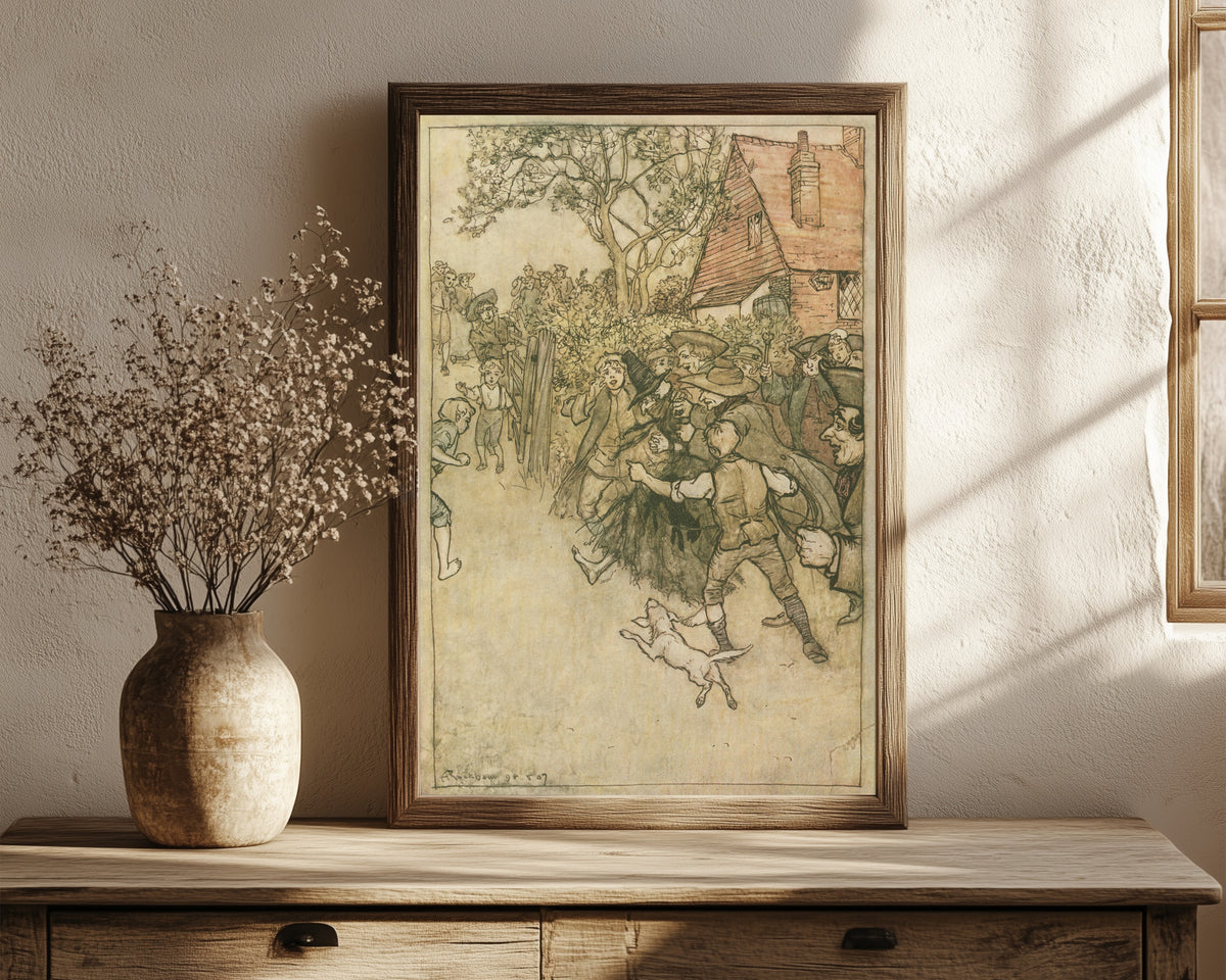 Framed art print of The Spectre of Tappington by Arthur Rackham, in a dark wood frame leaning on a rustic console beside dried flowers