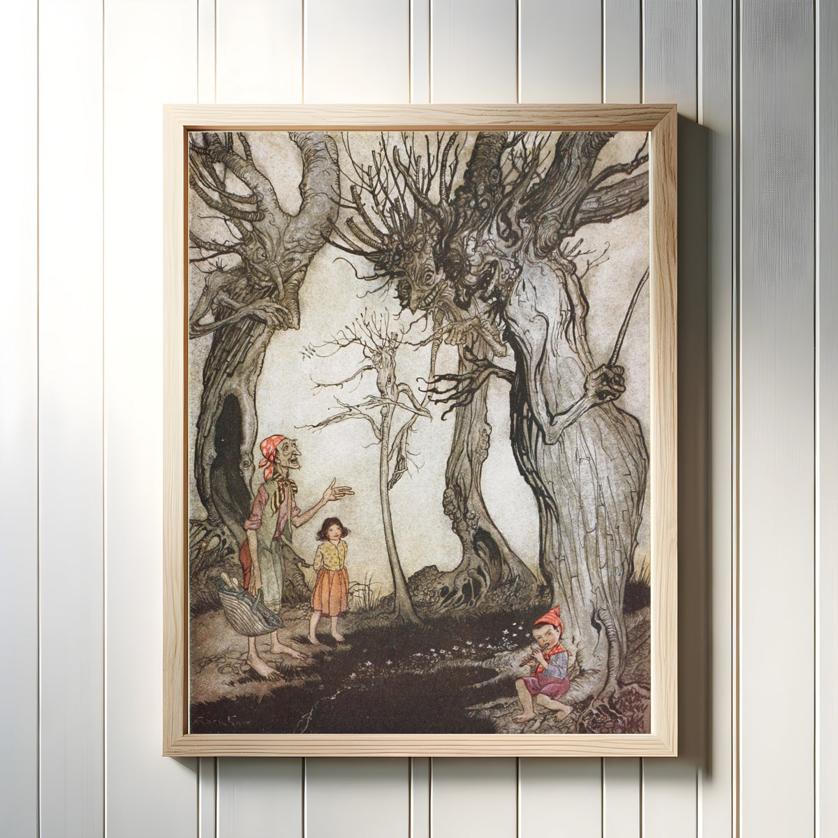 Framed art print of The Trees and the Axe by Arthur Rackham, in a light wood frame on a white panelled wall