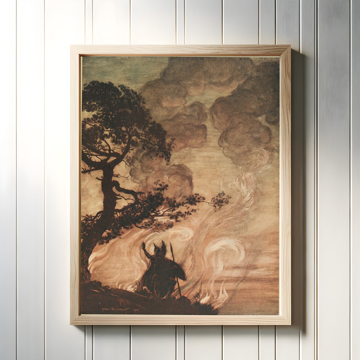 Framed art print of Wotan Turns and Looks Sorrowfully Back at Brünnhilde by Arthur Rackham, in a light wood frame on a white panelled wall