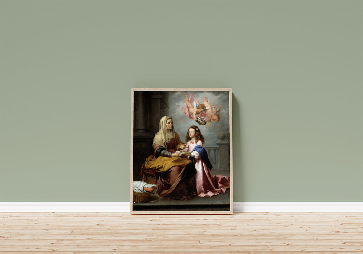 Framed art print of Saint Anne Teaching the Virgin to Read by Bartolomé Esteban Murillo, in a light wood frame leaning on a sage green wall above a wooden floor