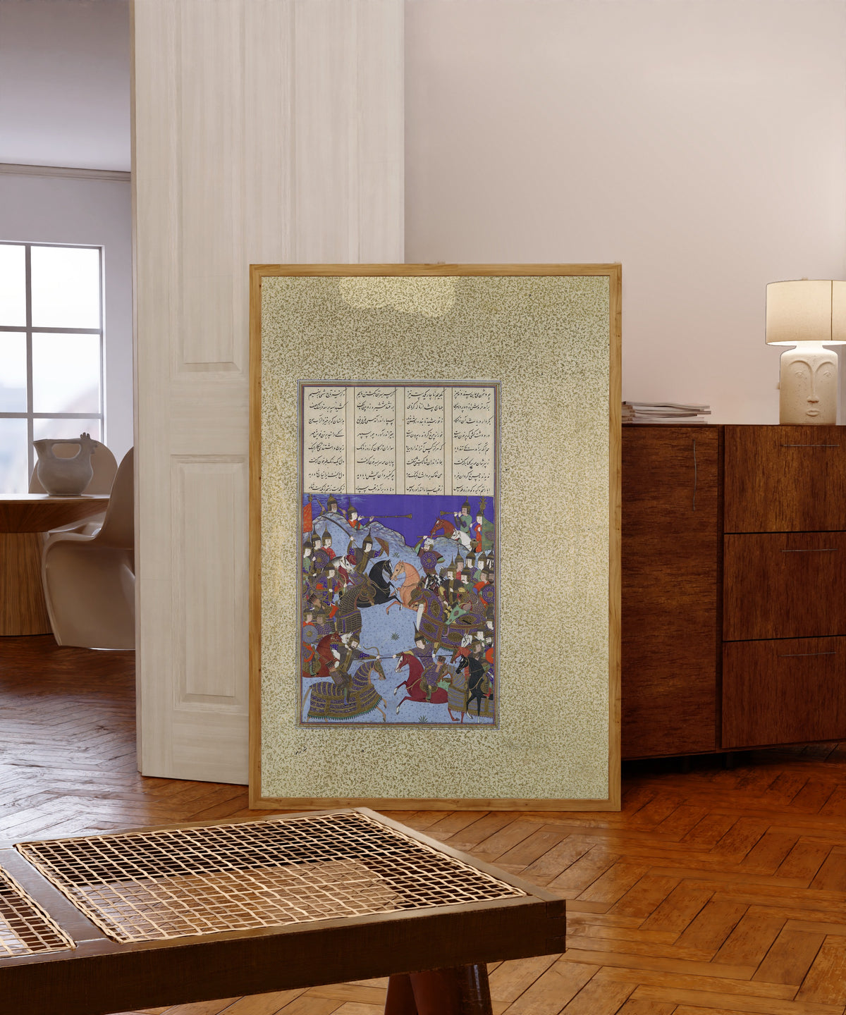 Framed art print of Shahnama of Shah Tahmasp: The Night Battle… by Bashdan Qara (attributed), in a light wood frame leaning in a warm room with a parquet floor