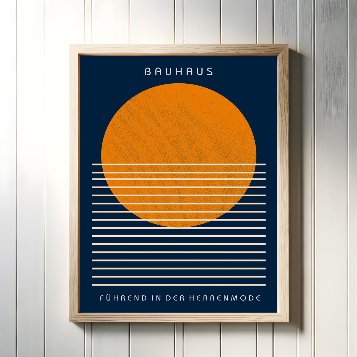 Framed art print of Führend by Bauhaus, in a light wood frame on a white panelled wall