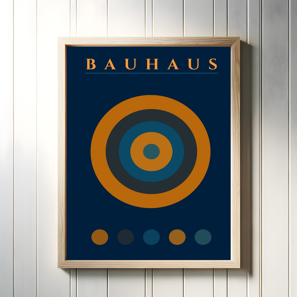 Framed art print of The Target by Bauhaus, in a light wood frame on a white panelled wall