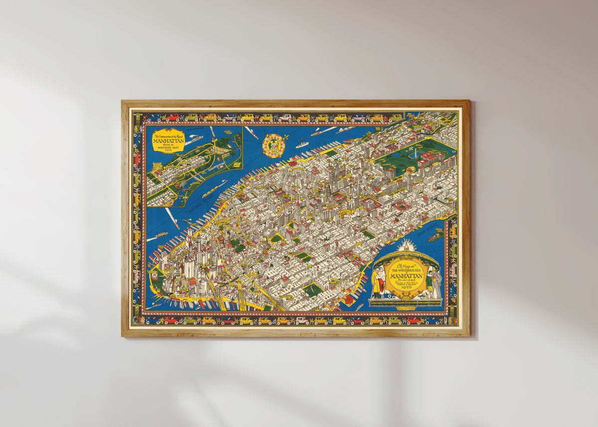 Framed art print of A Map of the Wondrous Isle of Manhattan by C. V. Farrow, in a light wood frame on a sunlit white wall