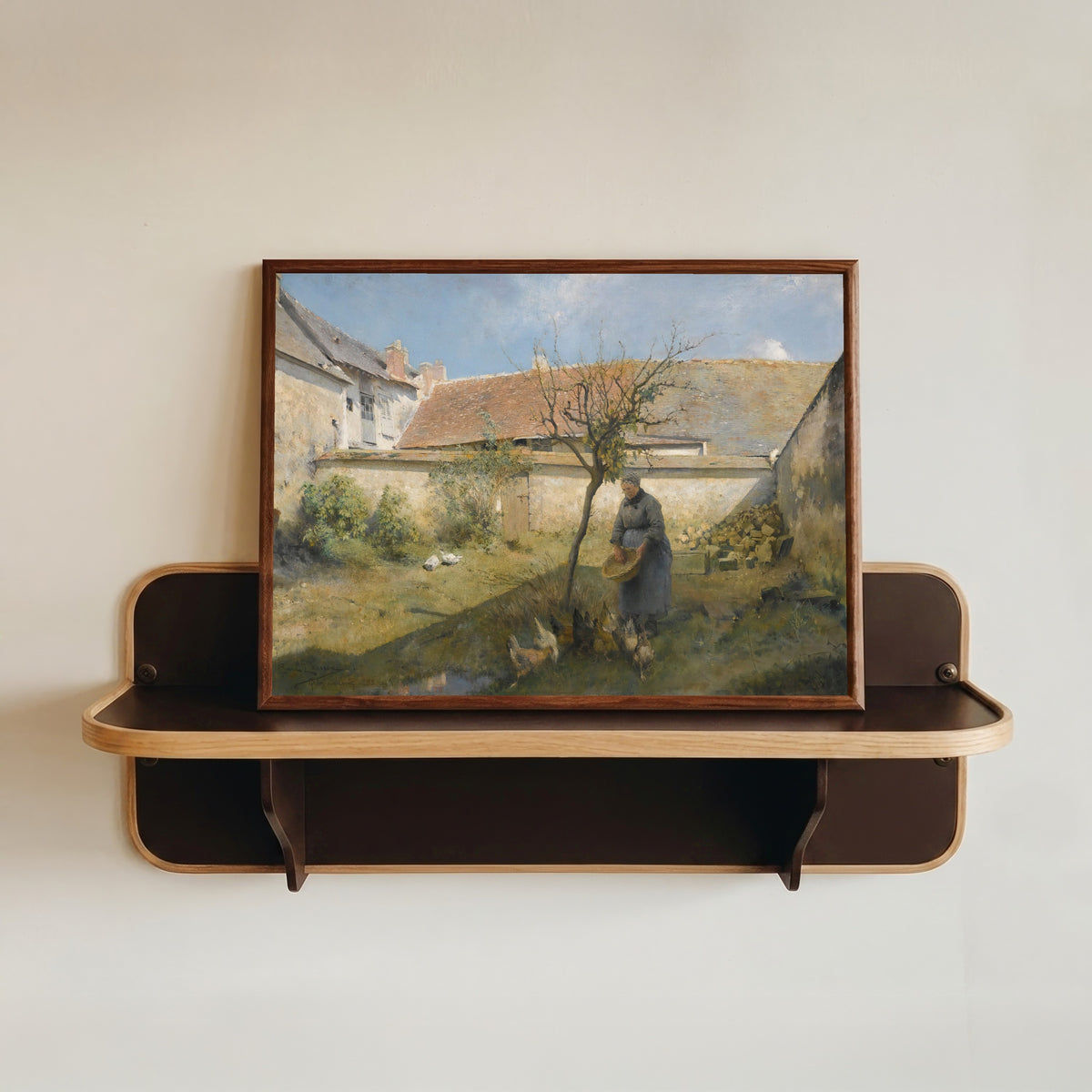 Framed art print of À la campagne by Carl Larsson, in a dark wood frame resting on a wall shelf