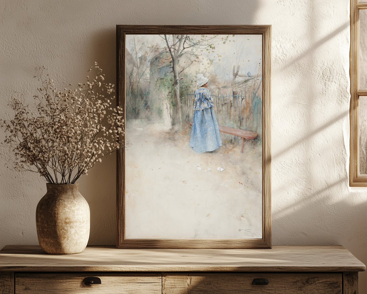 Framed art print of Autumn by Carl Larsson, in a dark wood frame leaning on a rustic console beside dried flowers
