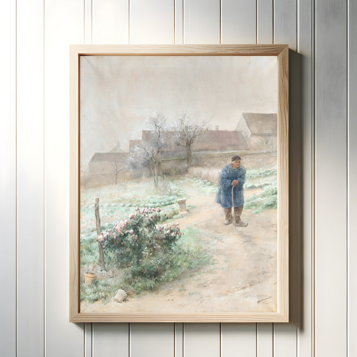 Framed art print of November by Carl Larsson, in a light wood frame on a white panelled wall