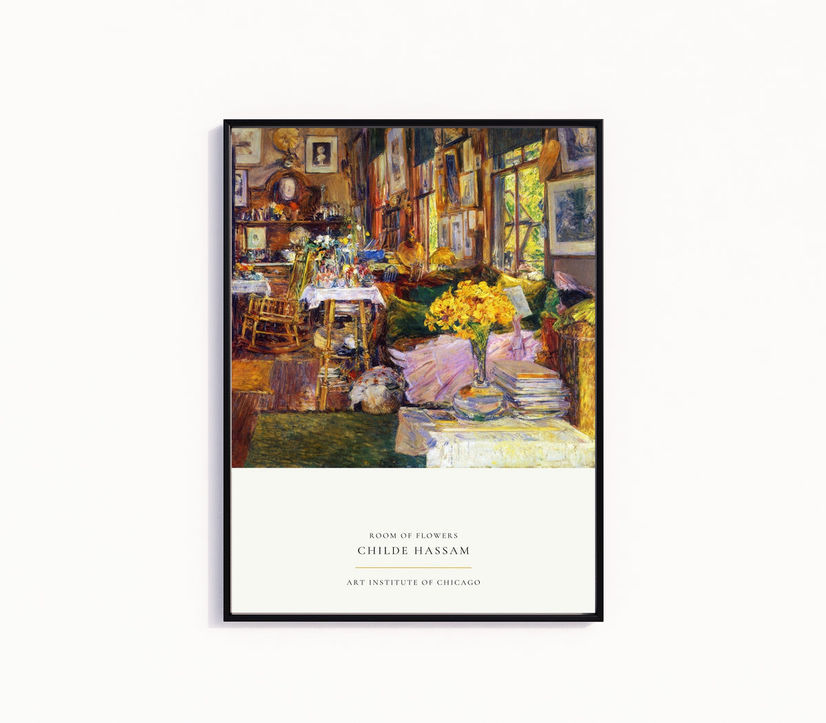 Framed art print of Room of Flowers by Childe Hassam, in a slim black frame on a plain white wall