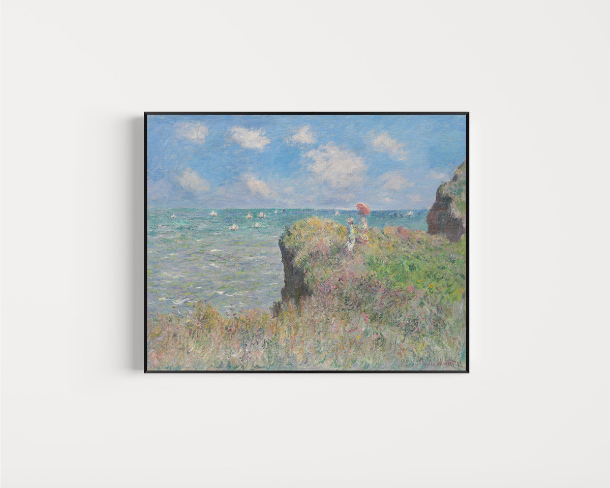 Framed art print of Cliff Walk at Pourville by Claude Monet, in a slim black frame on a plain white wall