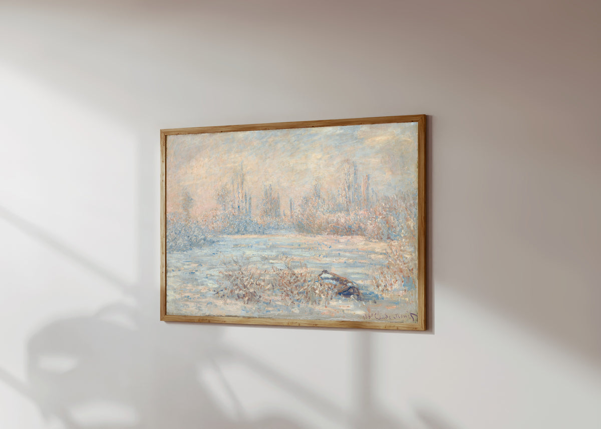 Framed art print of Hoarfrost (Le Givre) by Claude Monet, in a light wood frame on a sunlit white wall, seen at a slight angle