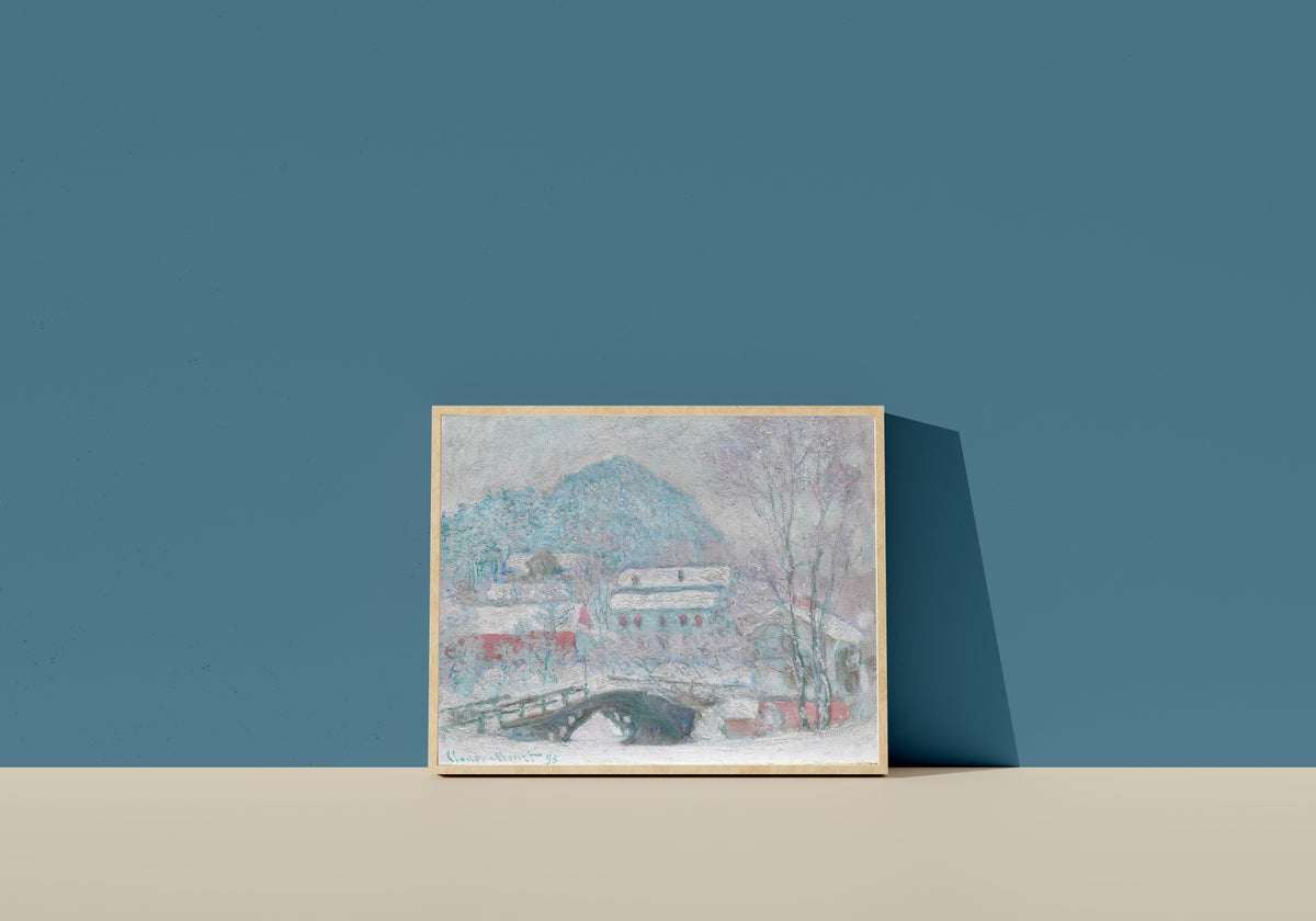 Framed art print of Sandvika, Norway by Claude Monet, in a light wood frame leaning on a blue wall