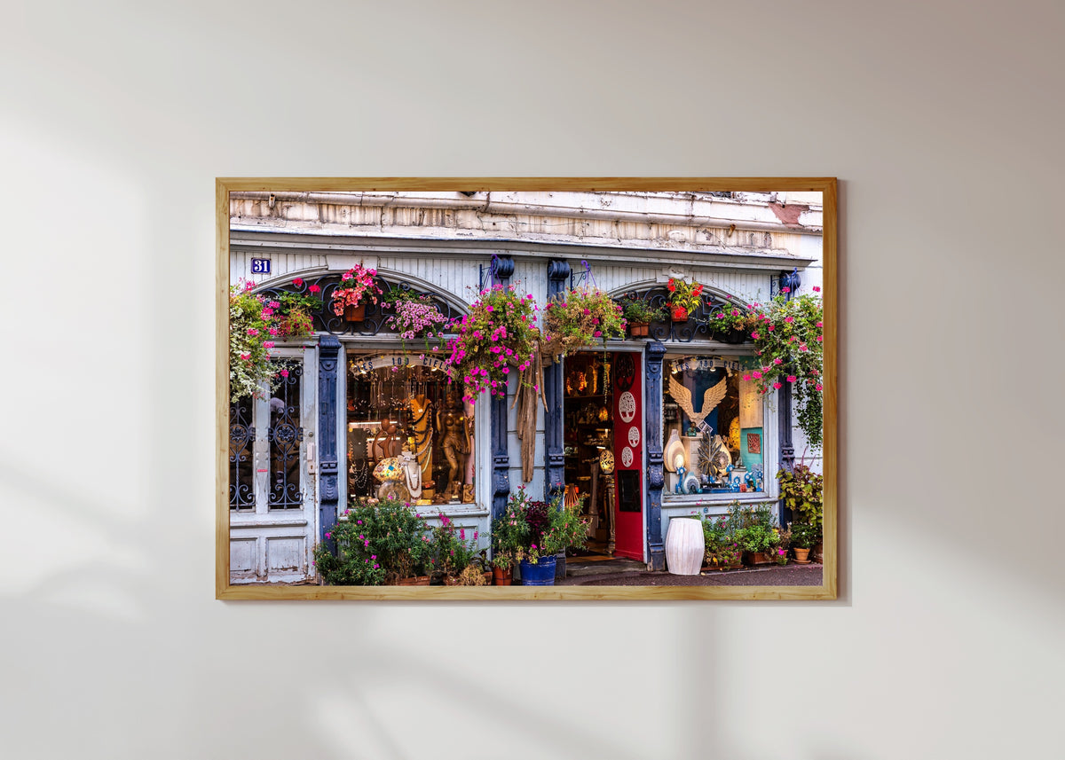 Framed art print of Colmar (Alsace) by Daniela Faust, in a light wood frame on a sunlit white wall