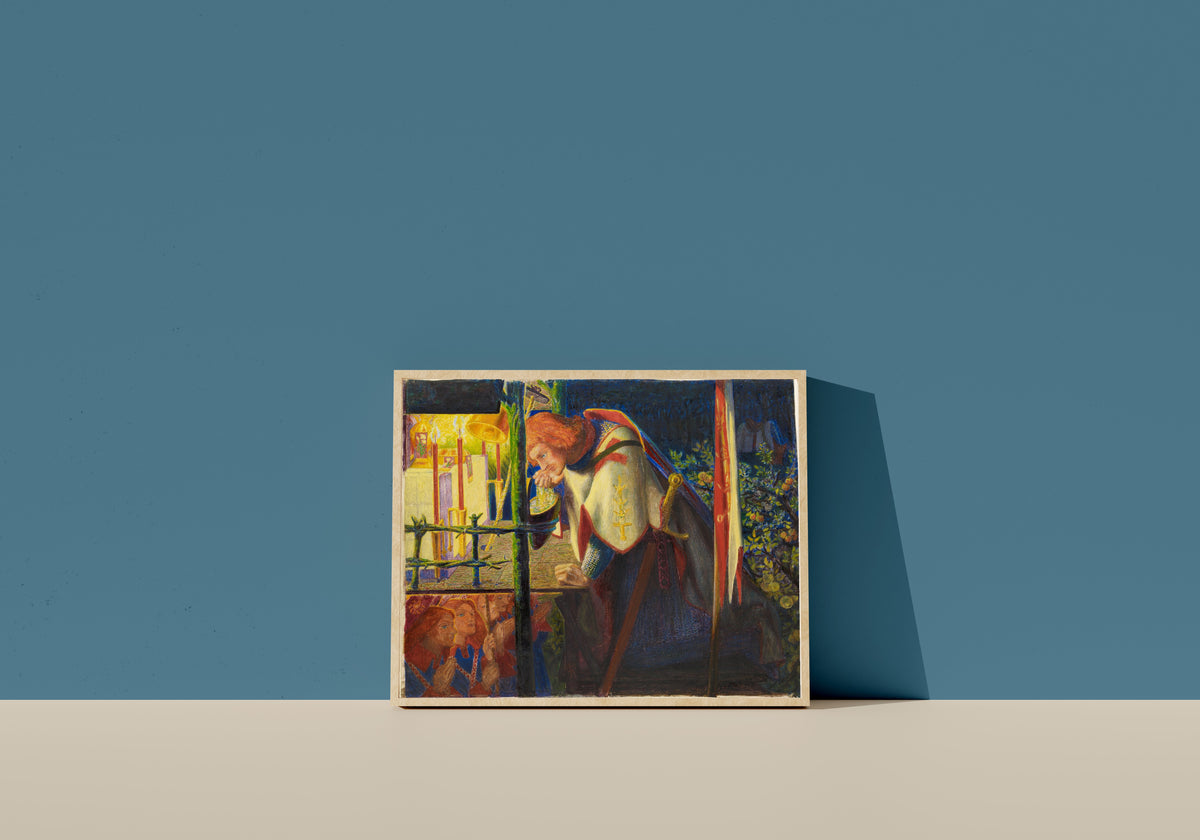 Framed art print of Sir Galahad at the Ruined Chapel by Dante Gabriel Rossetti, in a light wood frame leaning on a blue wall