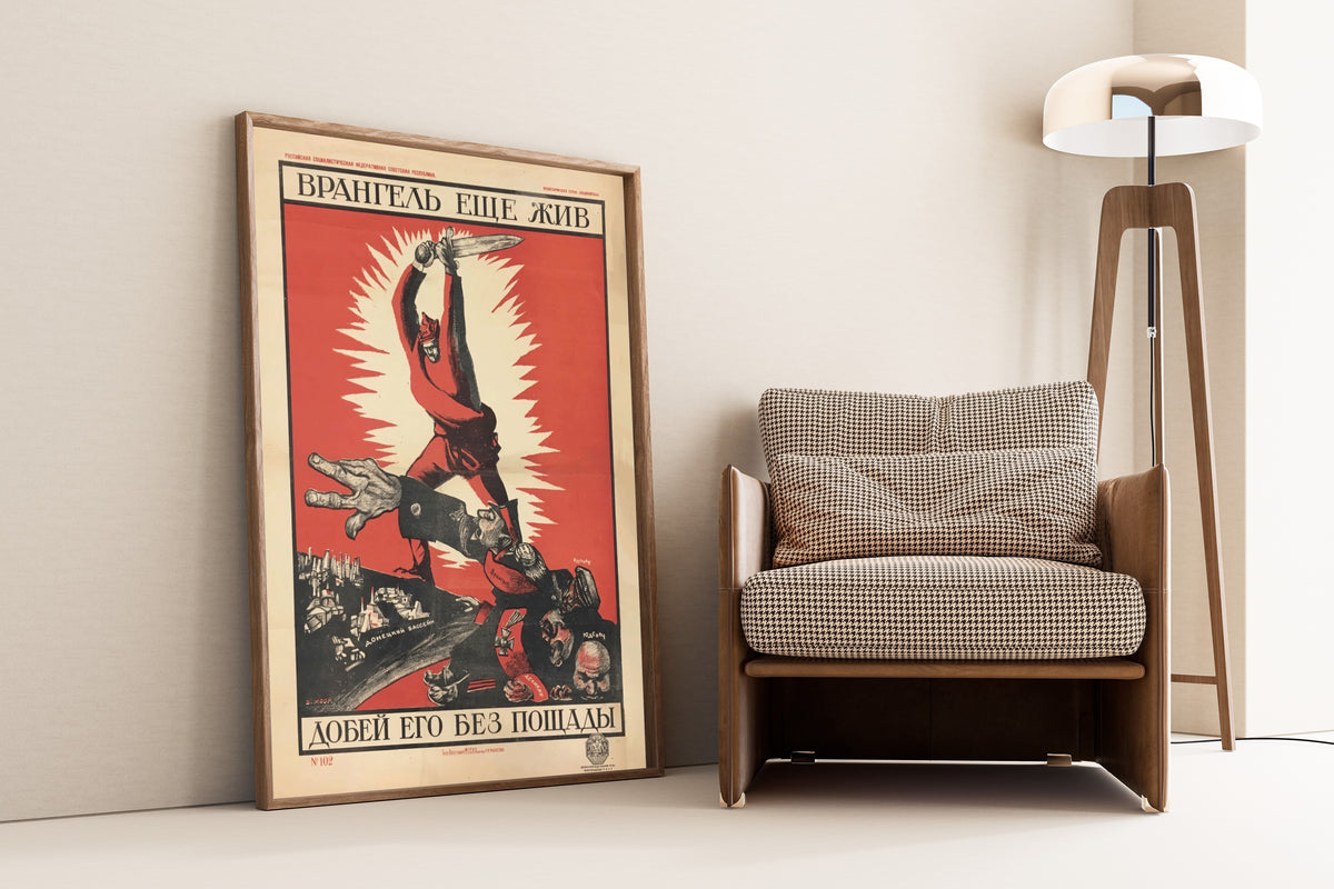 Framed art print of Finish Him Off Without Mercy! by Dmitry Moor, leaning against a wall beside an armchair and a floor lamp