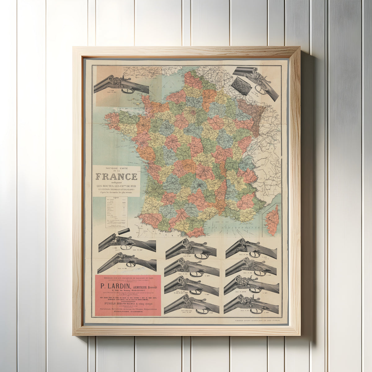 Framed art print of Shotgun Map of France by Dufrénoy, in a light wood frame on a white panelled wall