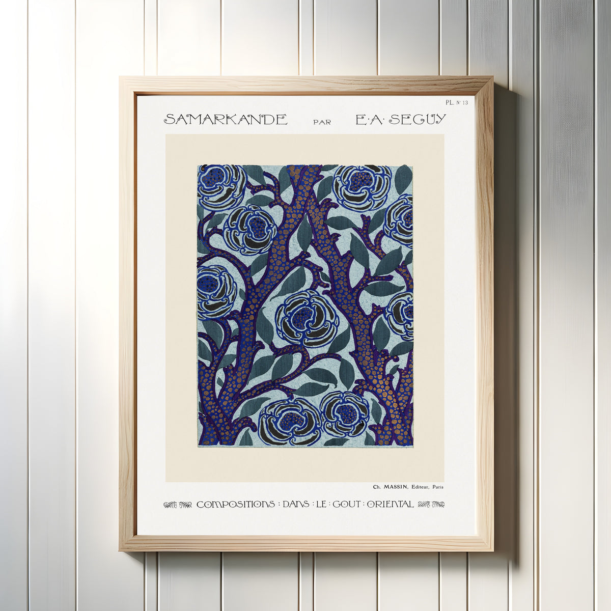 Framed art print of Samarkande, Plate 13 by E. A. Séguy, in a light wood frame on a white panelled wall