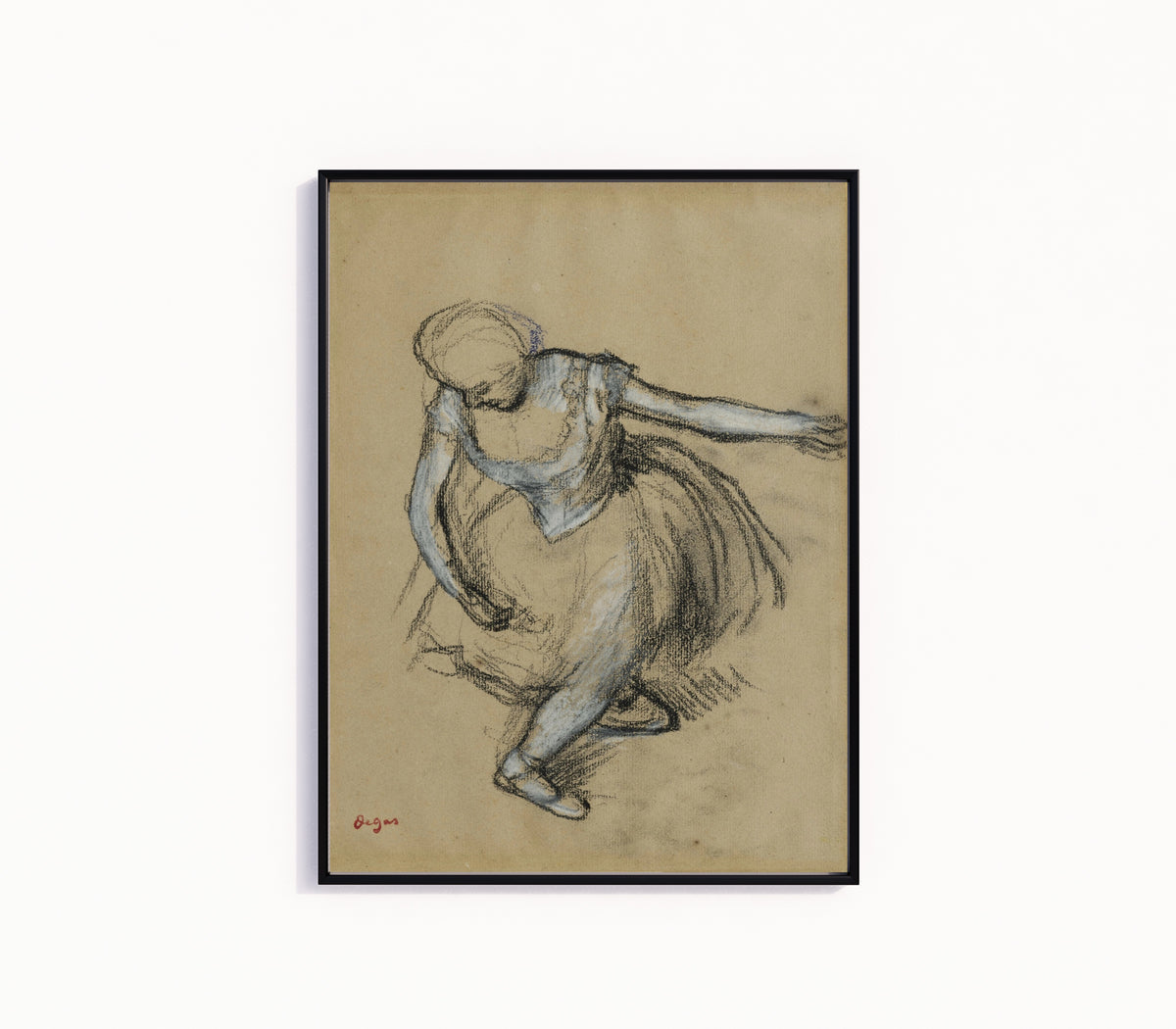 Framed art print of Danseuse saluant by Edgar Degas, in a slim black frame on a plain white wall