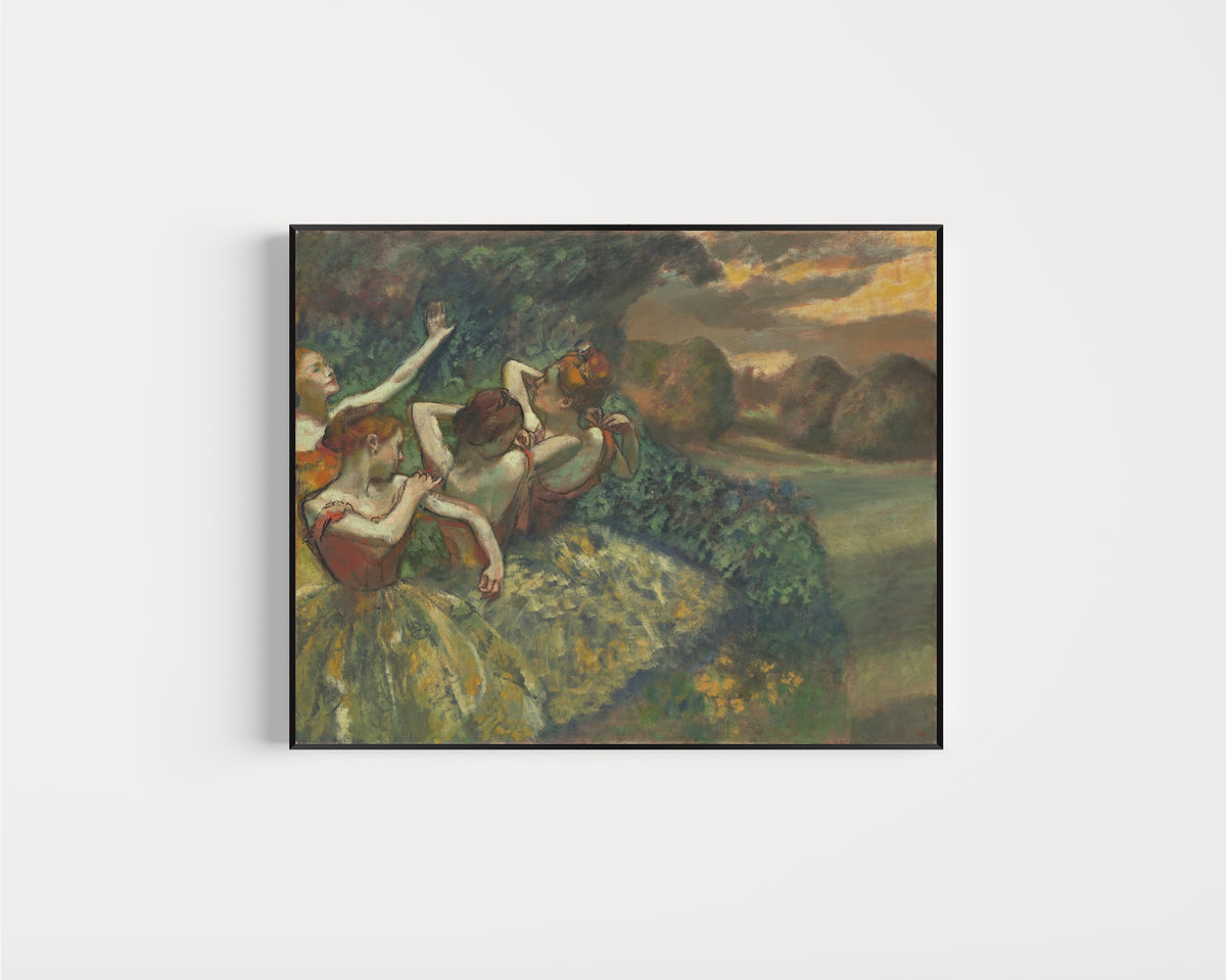 Framed art print of Four Dancers by Edgar Degas, in a slim black frame on a plain white wall
