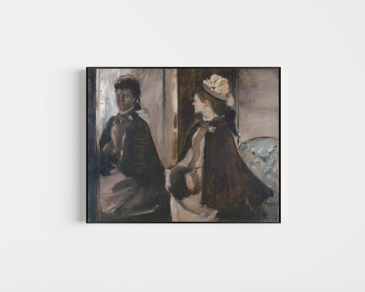 Framed art print of Mrs Jeantaud in the Mirror by Edgar Degas, in a slim black frame on a plain white wall