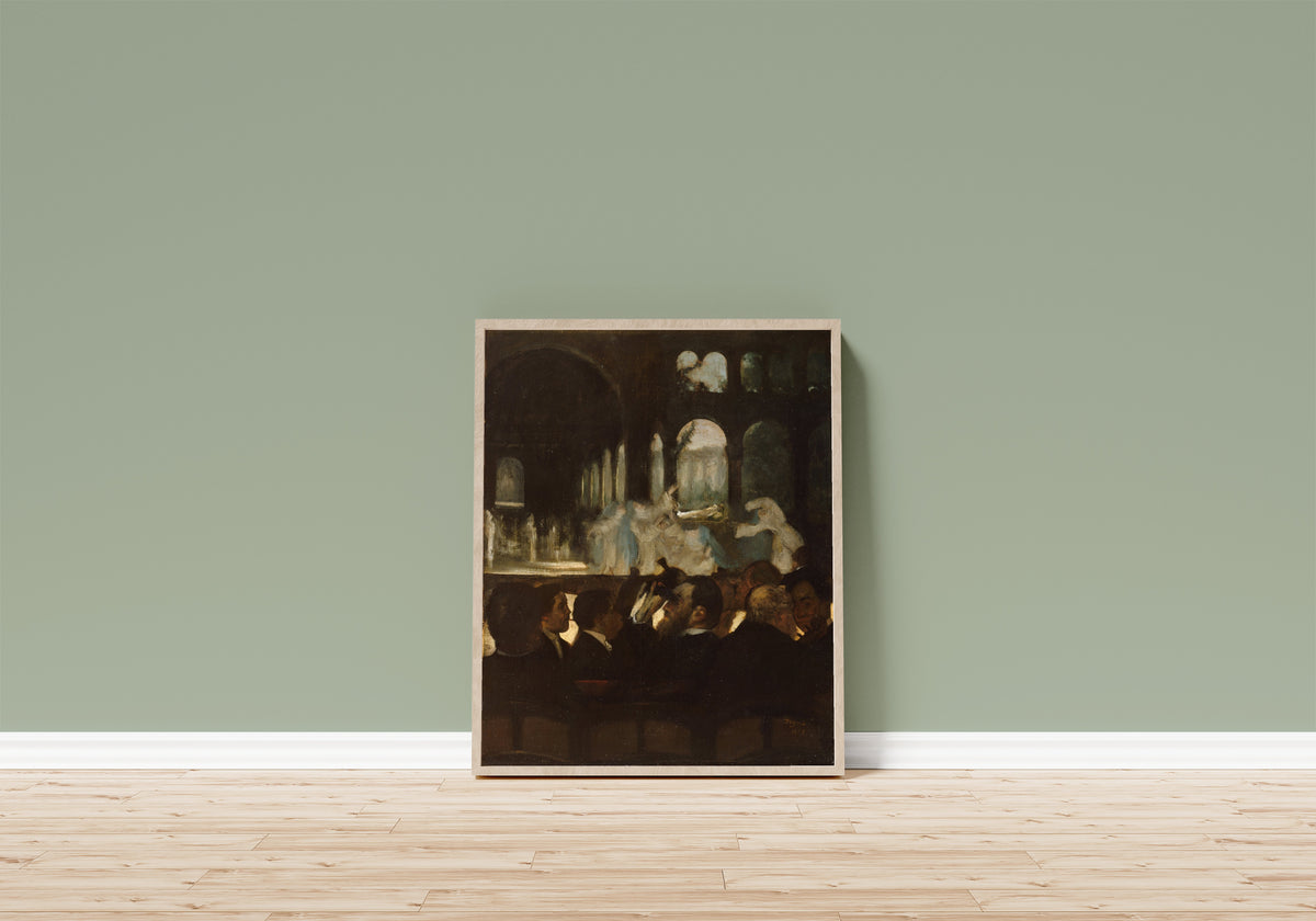 Framed art print of The Ballet from Robert le Diable by Edgar Degas, in a light wood frame leaning on a sage green wall above a wooden floor