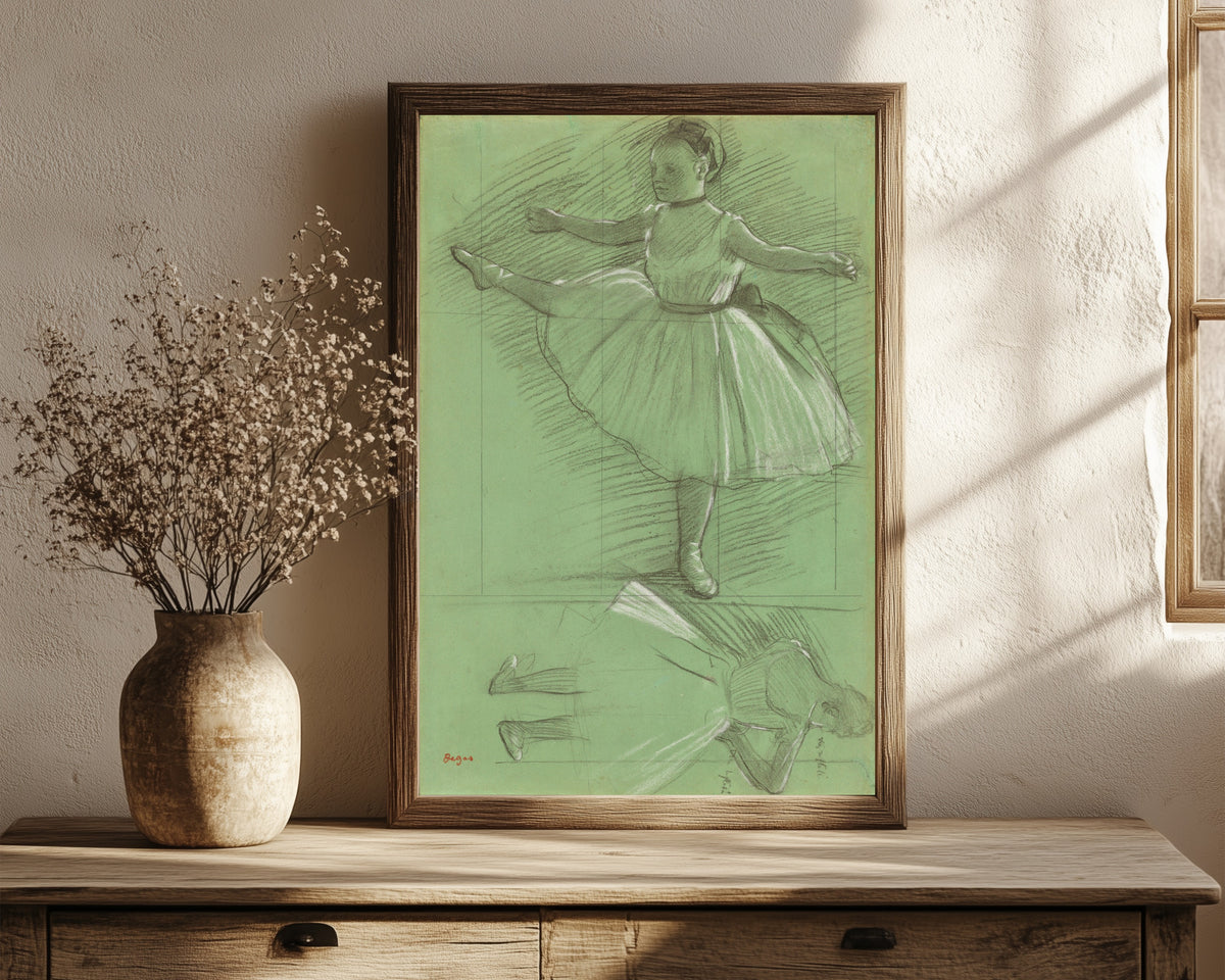 Framed art print of Two Studies of Dancers (Leg Raised to the Side) by Edgar Degas, in a dark wood frame leaning on a rustic console beside dried flowers