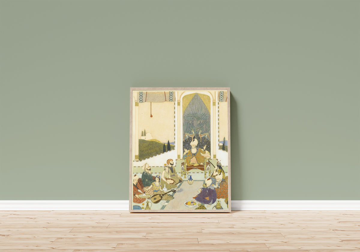 Framed art print of Sindbad the Sailor Entertains Sindbad the Landsman by Edmund Dulac, in a light wood frame leaning on a sage green wall above a wooden floor