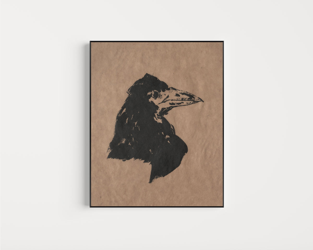 Framed art print of Raven's Head in Profile by Édouard Manet, in a slim black frame on a plain white wall