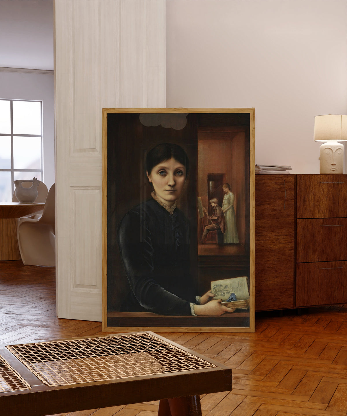 Framed art print of Portrait of Georgiana Burne-Jones (with Philip… by Edward Burne-Jones, in a light wood frame leaning in a warm room with a parquet floor