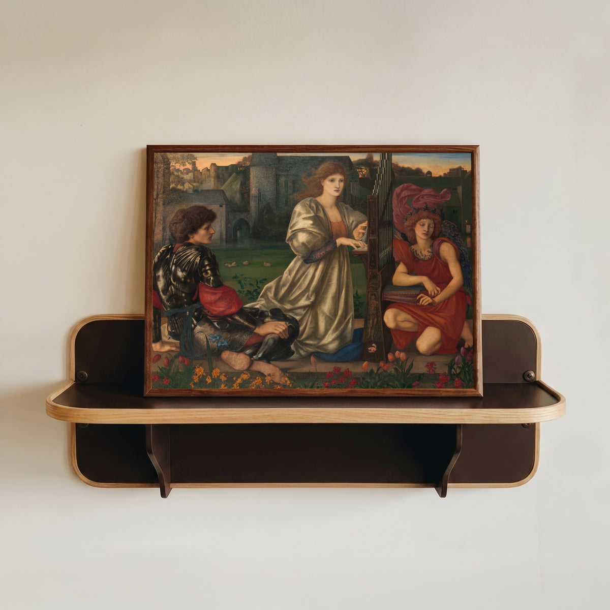 Framed art print of The Love Song by Edward Burne-Jones, in a dark wood frame resting on a wall shelf