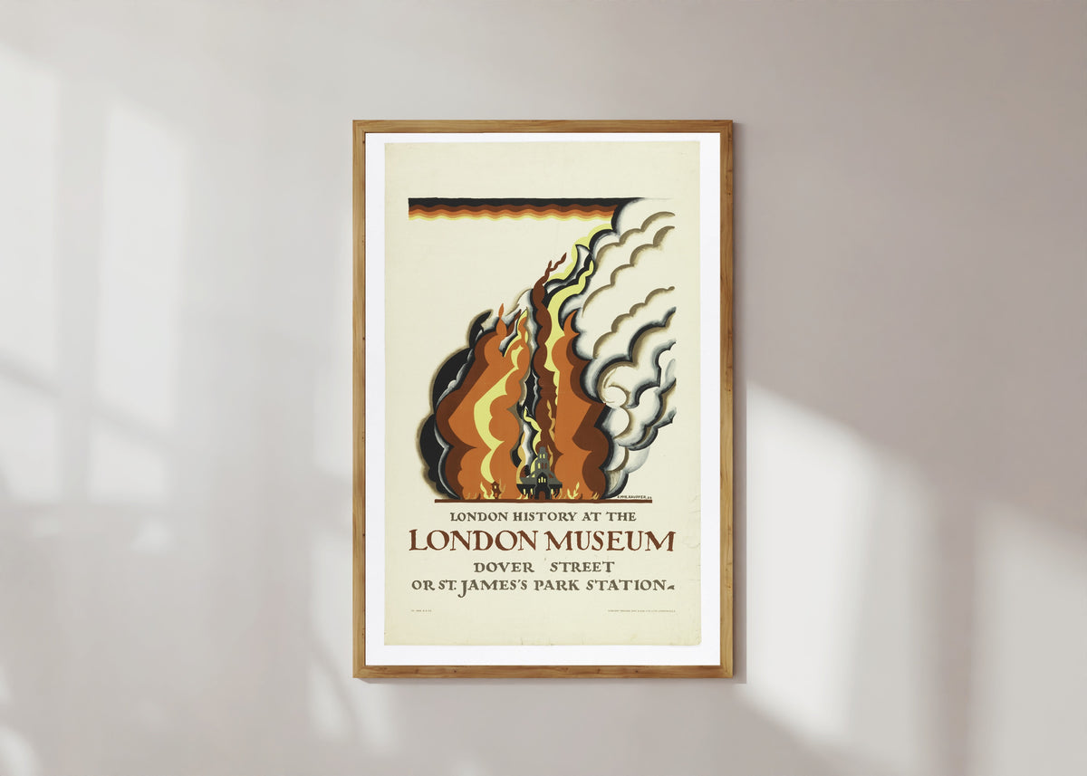 Framed art print of London History at the London Museum by Edward McKnight Kauffer, in a light wood frame on a sunlit white wall