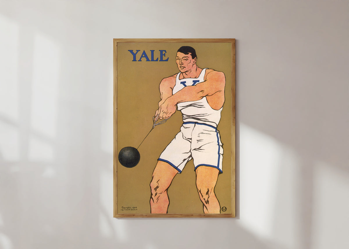 Framed art print of Yale by Edward Penfield, in a light wood frame on a sunlit white wall