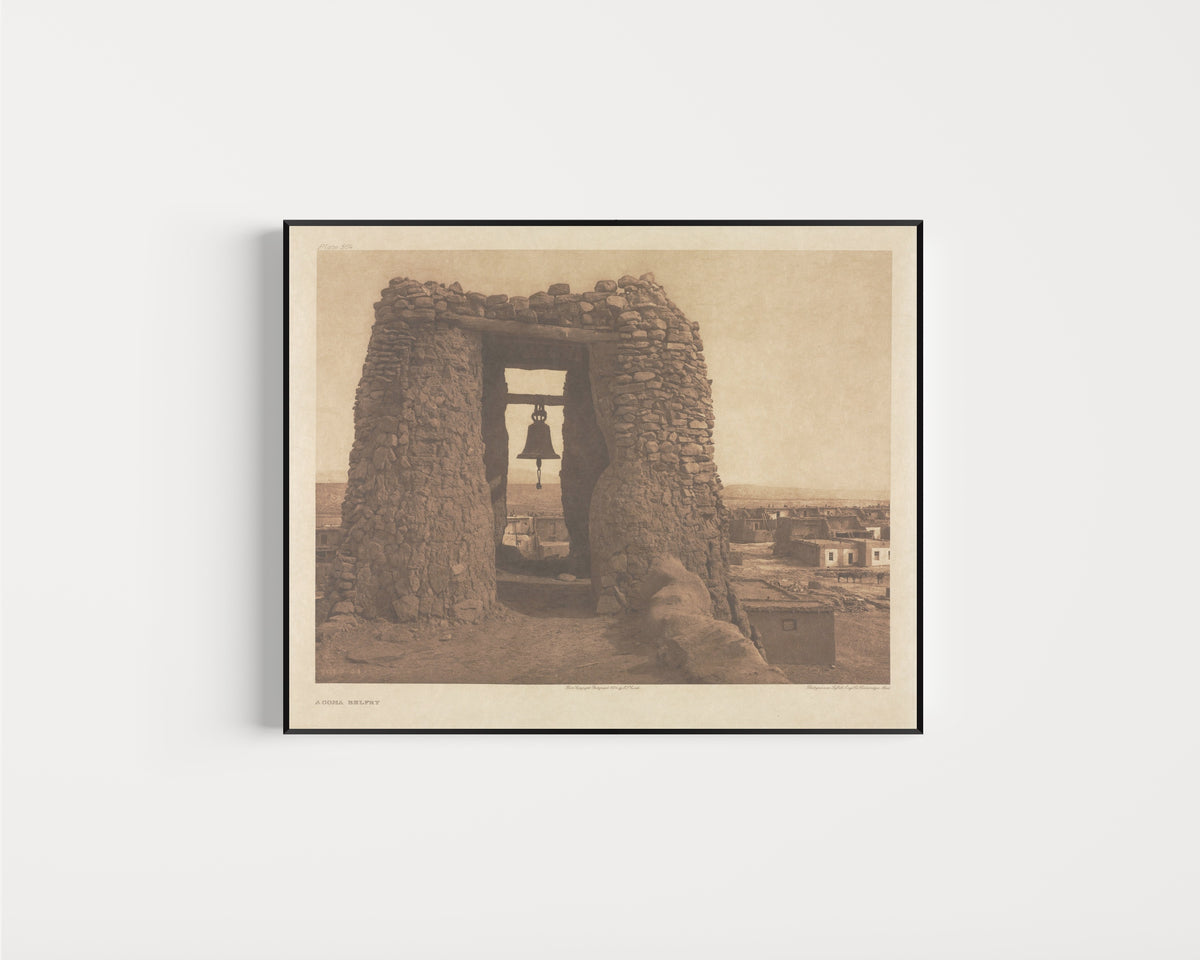 Framed art print of Acoma Belfry by Edward S. Curtis, in a slim black frame on a plain white wall
