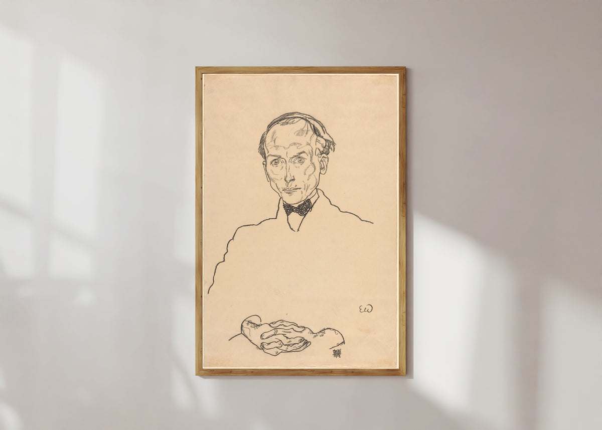 Framed art print of Dr. Ernst Wagner by Egon Schiele, in a light wood frame on a sunlit white wall